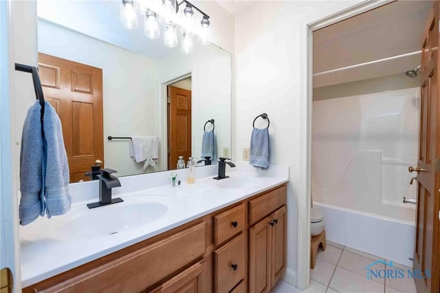 full bathroom with tile patterned flooring, vanity, bathtub / shower combination, and toilet