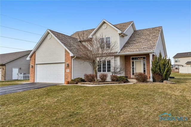 view of front facade featuring a garage and a front yard