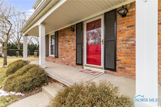 doorway to property featuring covered porch