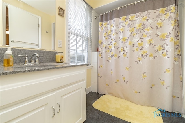 bathroom featuring vanity and walk in shower