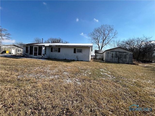 rear view of house with a yard