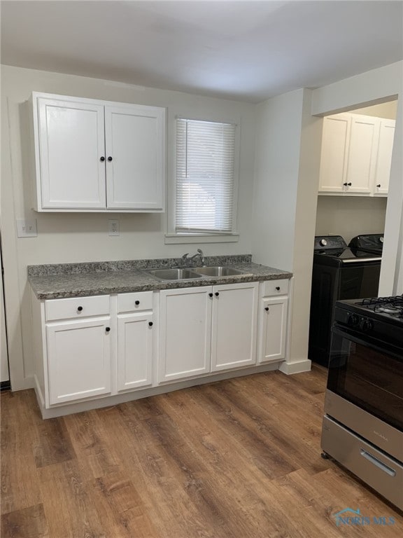 kitchen with white cabinetry and sink