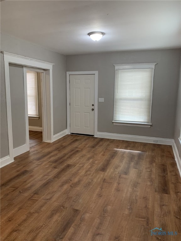 foyer entrance with dark wood-type flooring