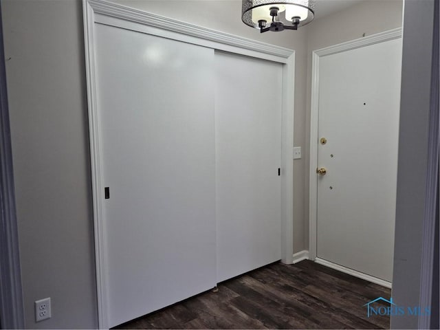 entryway with dark hardwood / wood-style floors