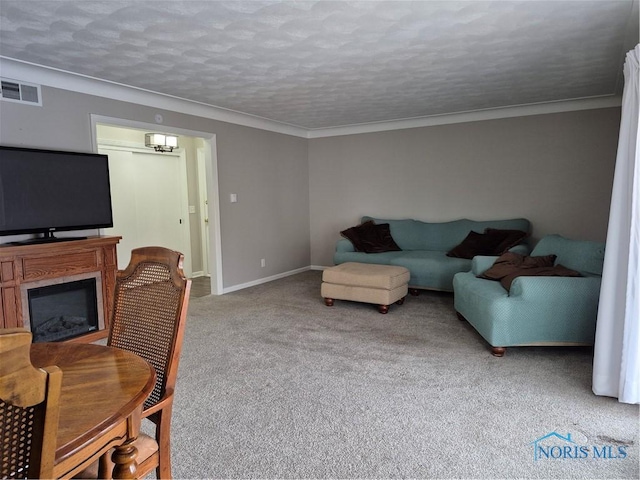 carpeted living room with crown molding and a textured ceiling