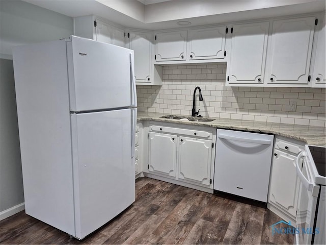 kitchen with white cabinetry, sink, white appliances, and light stone countertops