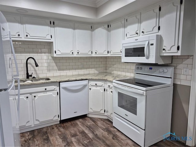 kitchen featuring light stone countertops, dark hardwood / wood-style floors, white cabinets, and white appliances