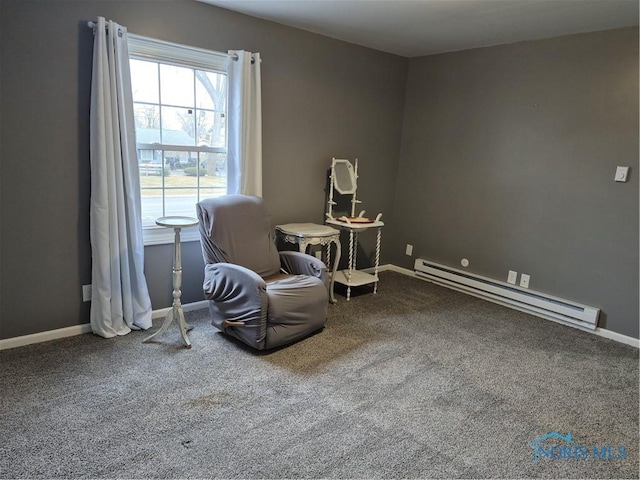 living area featuring carpet and baseboard heating