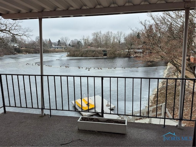 balcony featuring a water view