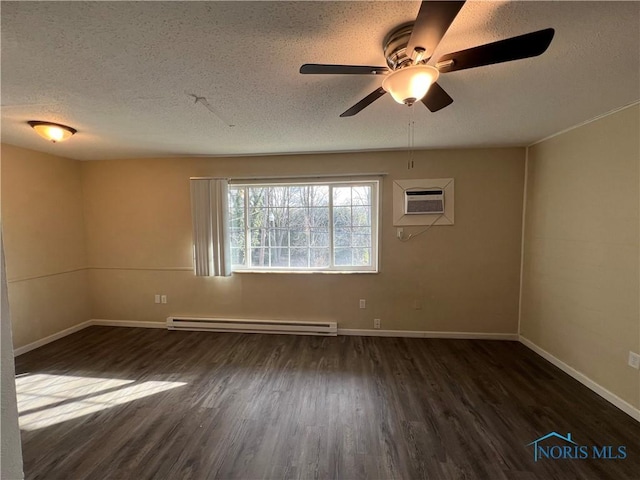 empty room featuring a textured ceiling, an AC wall unit, dark hardwood / wood-style flooring, ceiling fan, and a baseboard heating unit