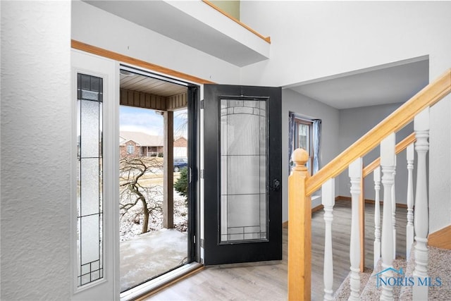 foyer entrance with light hardwood / wood-style flooring