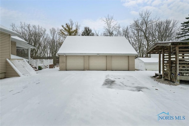 view of snow covered garage