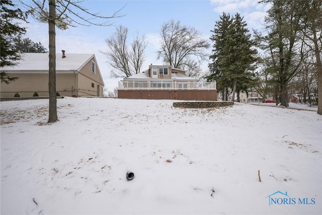 view of yard covered in snow