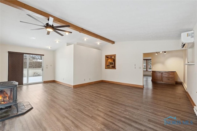 unfurnished living room with a wood stove, dark hardwood / wood-style flooring, a wall unit AC, vaulted ceiling with beams, and ceiling fan