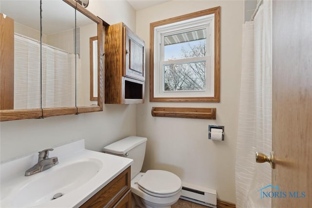 bathroom featuring a baseboard radiator, toilet, and vanity