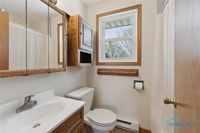 full bathroom with vanity, a baseboard heating unit, and toilet