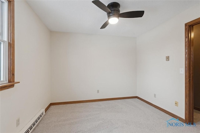 unfurnished room featuring ceiling fan, a baseboard heating unit, and light colored carpet