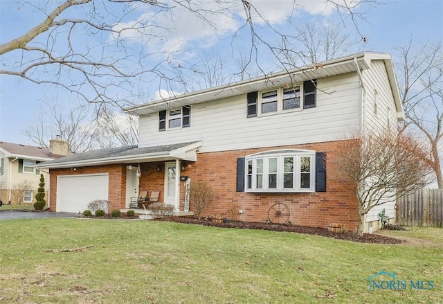 front of property with a porch, a garage, and a front yard