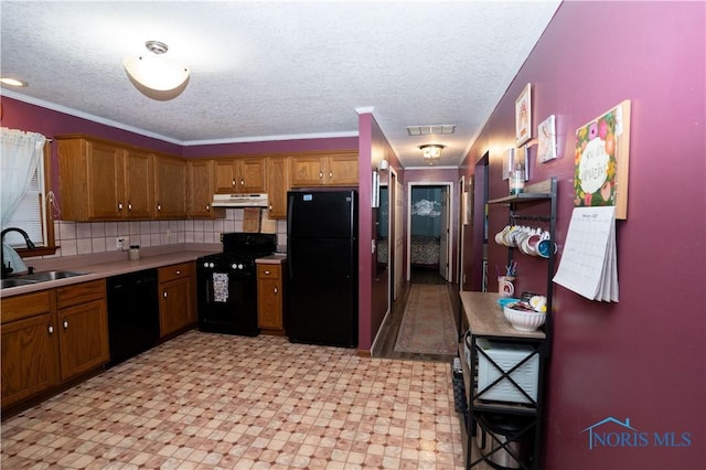 kitchen featuring sink, crown molding, backsplash, black appliances, and a textured ceiling