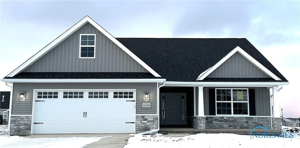 craftsman-style home with a garage and covered porch