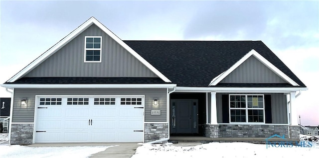 craftsman-style home with a garage and covered porch