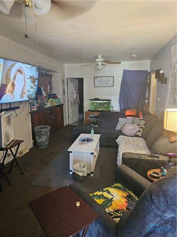 living area featuring carpet and a ceiling fan