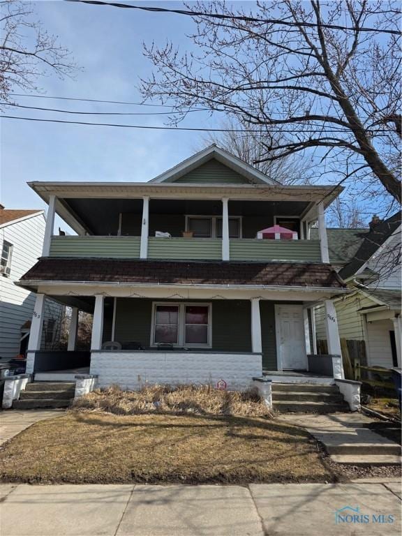 view of front of property with a porch and a balcony