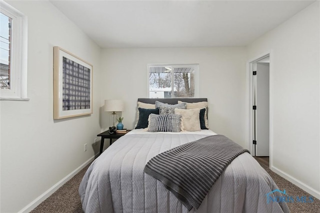 bedroom featuring dark carpet