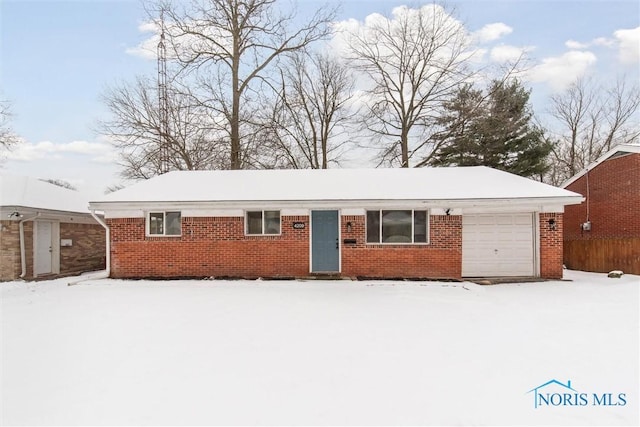 ranch-style home with a garage, fence, and brick siding