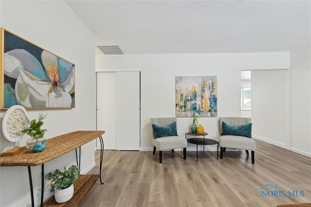 sitting room featuring light hardwood / wood-style floors