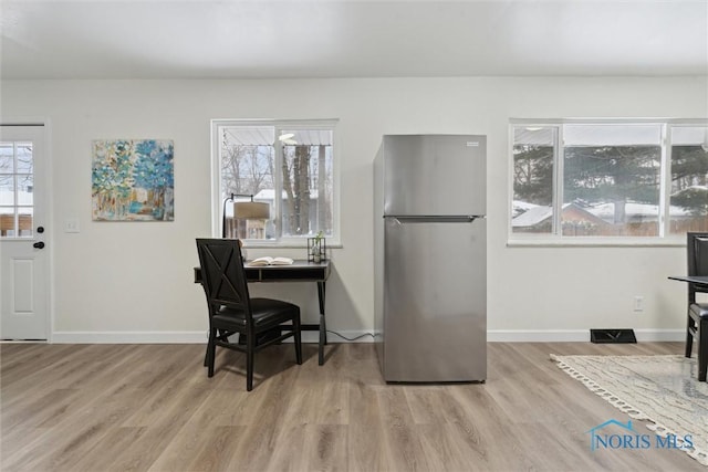 interior space with light hardwood / wood-style floors