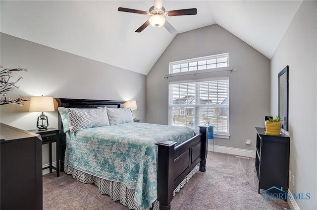 bedroom with vaulted ceiling, ceiling fan, and carpet floors