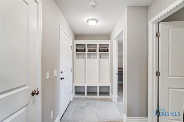 mudroom with light tile patterned floors