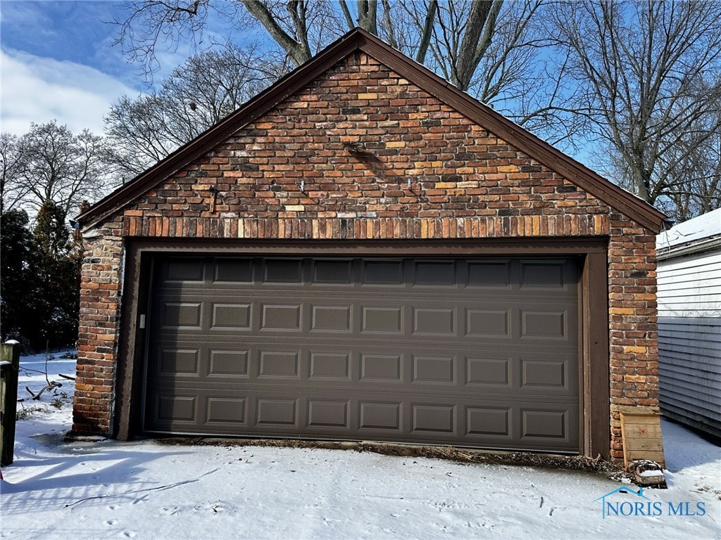 view of snow covered garage