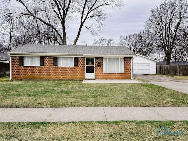 single story home with a garage and a front lawn