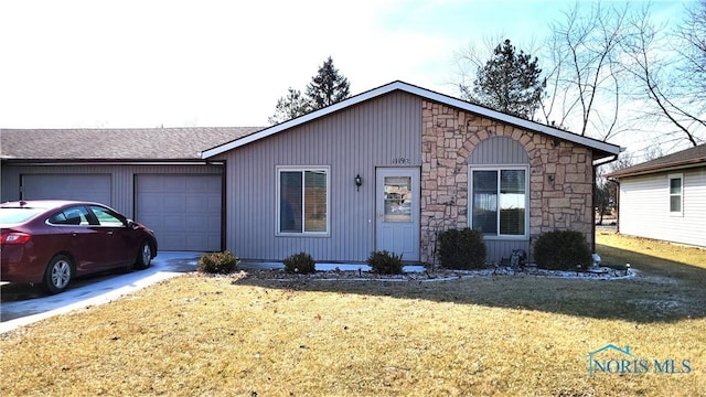 ranch-style house with a garage and a front yard