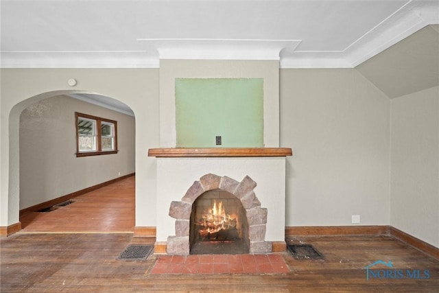 unfurnished living room with vaulted ceiling and hardwood / wood-style floors