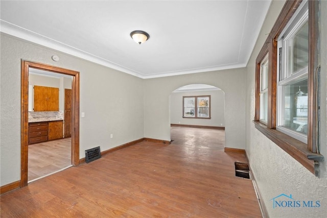 unfurnished room featuring light wood-type flooring