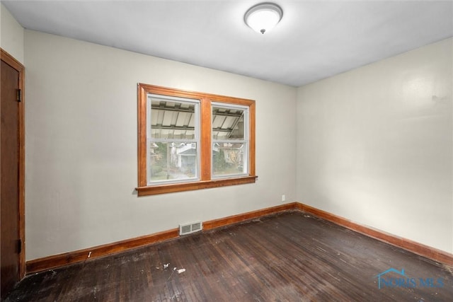 unfurnished room featuring wood-type flooring