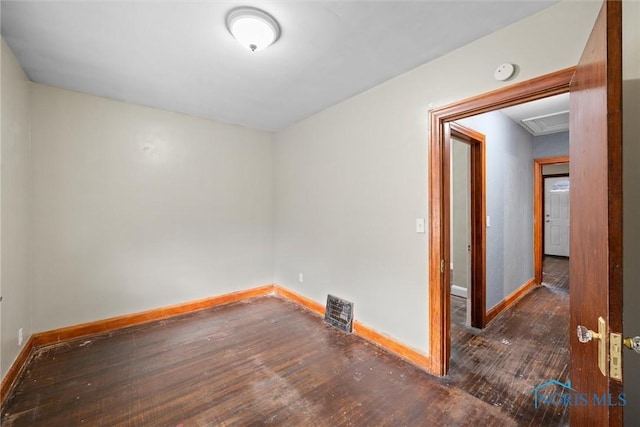 empty room with dark hardwood / wood-style floors