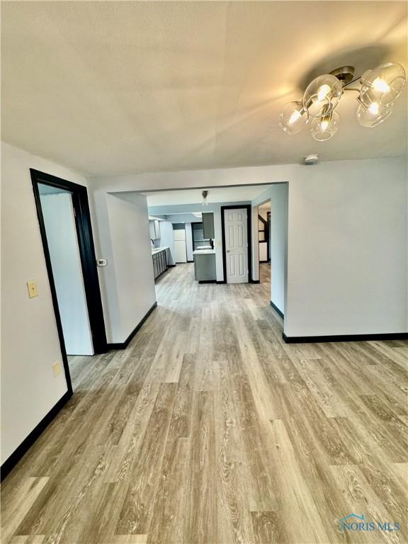 unfurnished room featuring light hardwood / wood-style floors