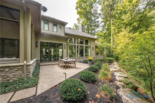 rear view of house featuring a patio area