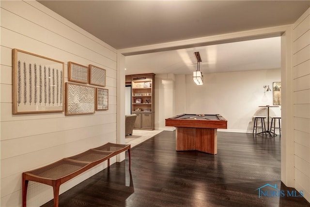 game room with dark hardwood / wood-style floors, pool table, and wooden walls