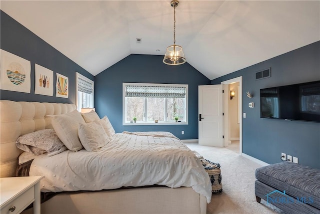 carpeted bedroom featuring vaulted ceiling