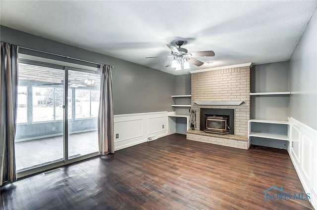 unfurnished living room with ceiling fan and dark hardwood / wood-style flooring