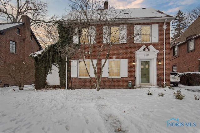 view of front of property featuring brick siding