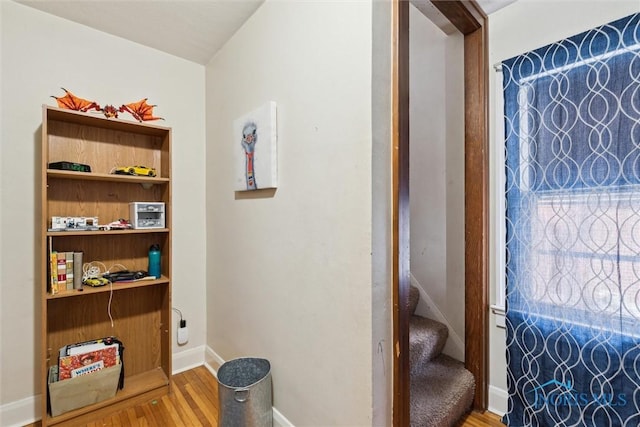 interior space featuring wood finished floors and baseboards