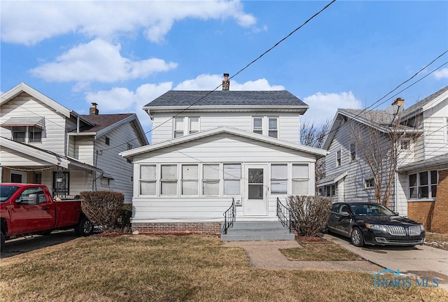 view of front of house with a front lawn