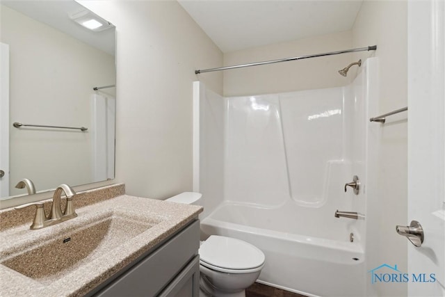 full bathroom with shower / bathtub combination, vanity, and toilet