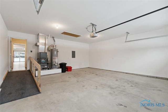 garage featuring water heater, electric panel, and a garage door opener